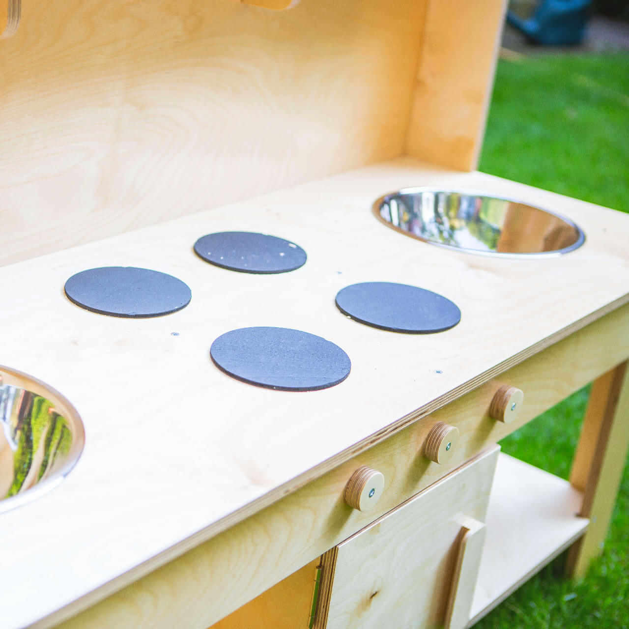 close up of the top of the double bowl mud kitchen