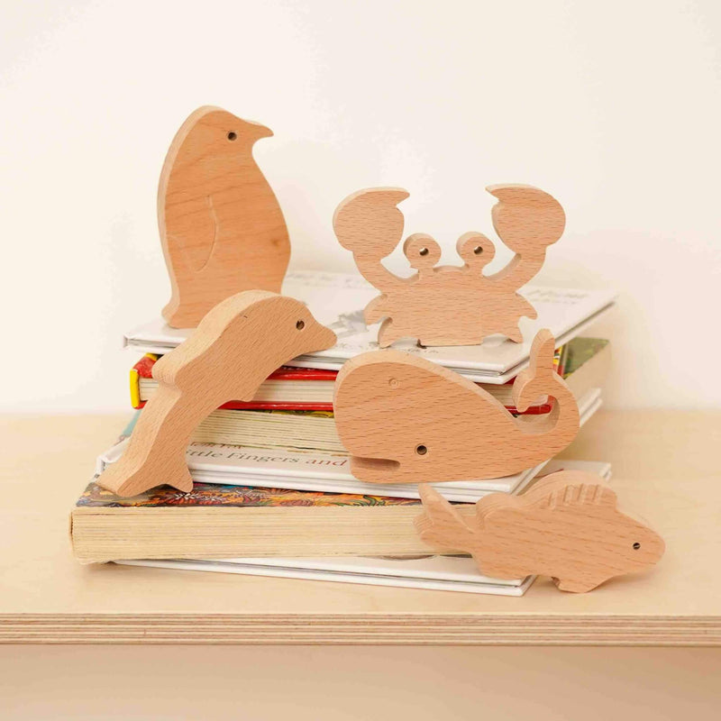 wooden sea animals collection on books