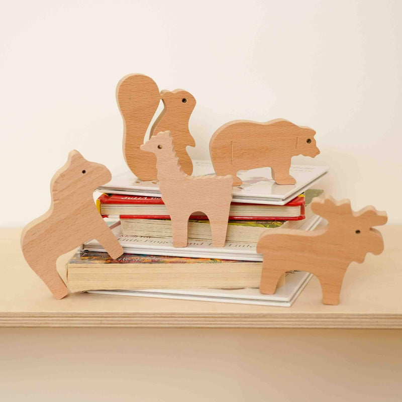 wooden woodland animals collection on books