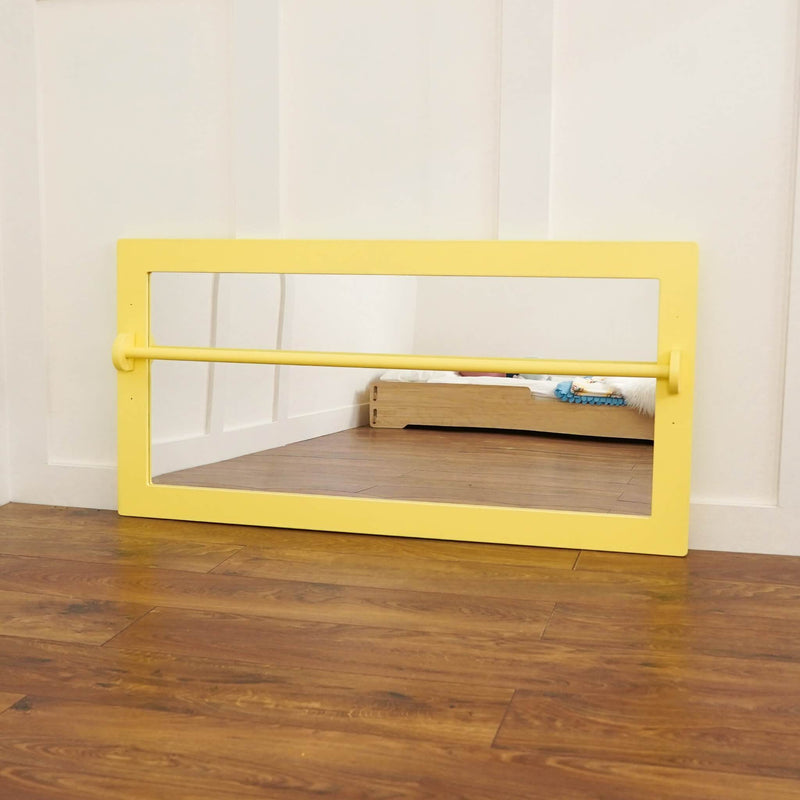 yellow infant pull up bar and mirror